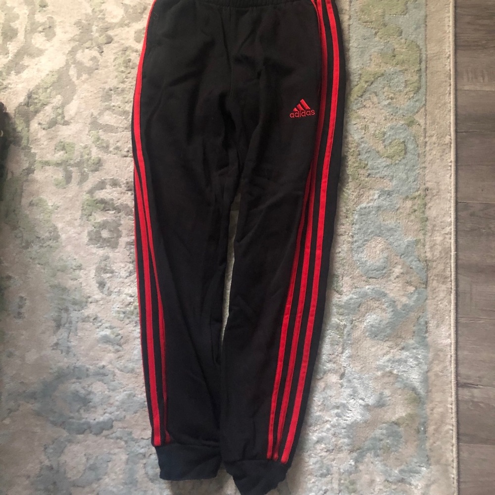 Black Adidas joggers with Red stripes
